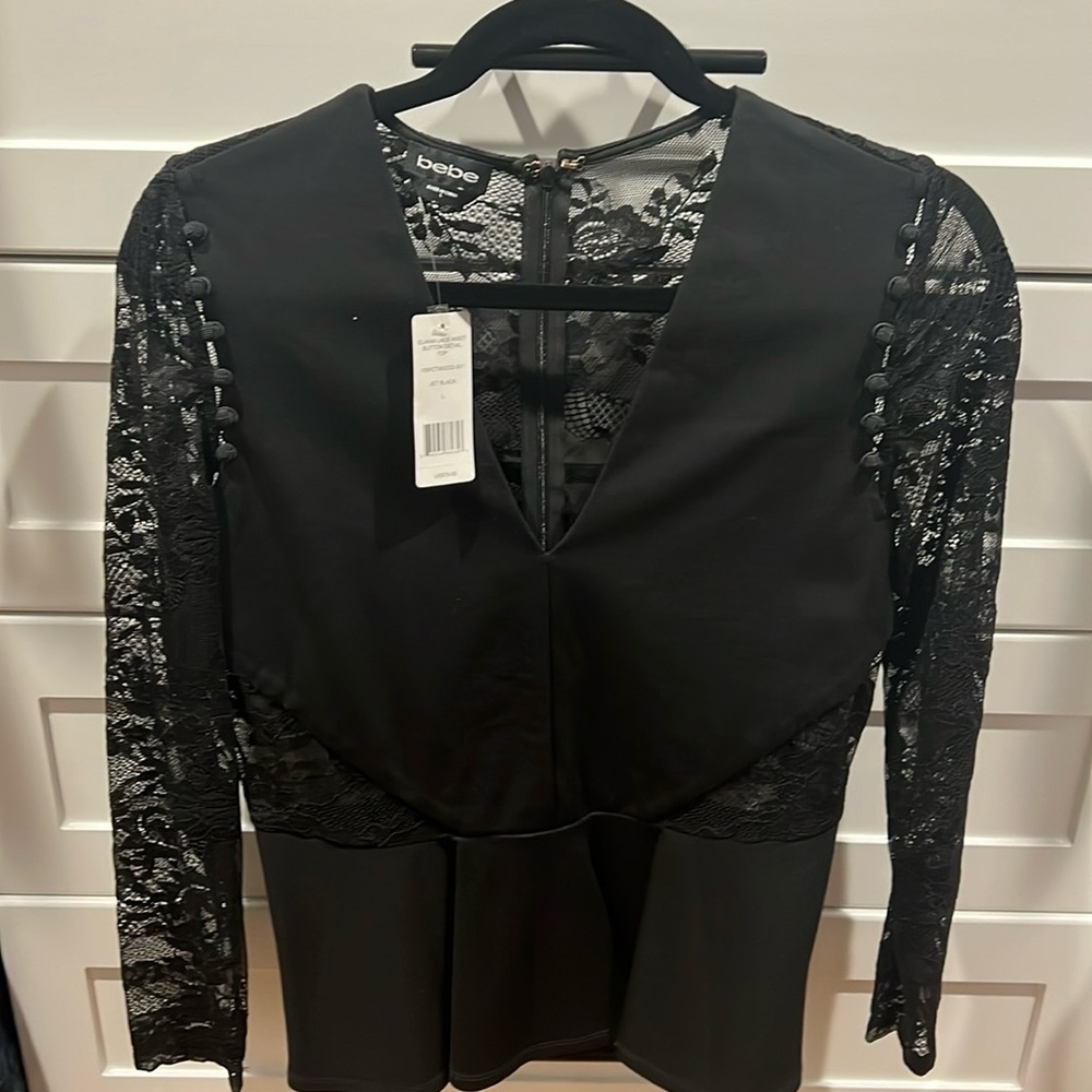 New!! Bebe black with lace peplum top.
